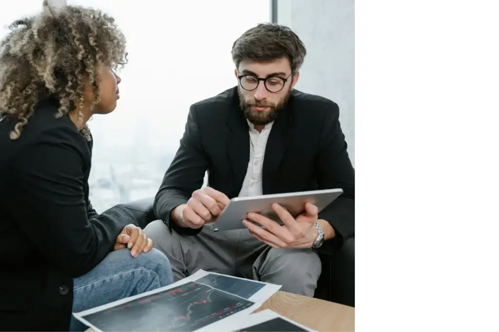 Two professionals discussing testing strategies, illustrating Mellonne's comprehensive end-to-end testing services